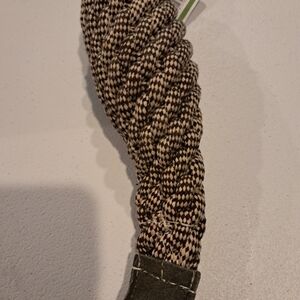 a braided rope dog toy, commonly used for chewing, fetching,